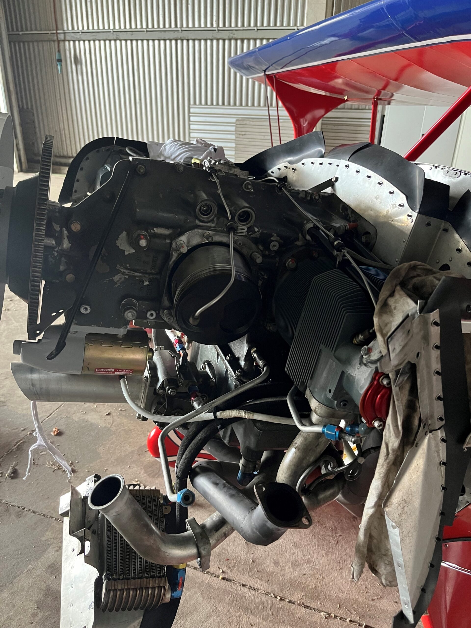 Stripped-down aircraft engine being overhauled on the workbench