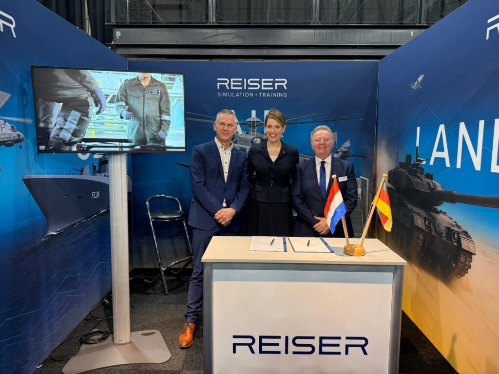 Representatives of REISER and Royal NLR at the signing, with Dutch and German flags