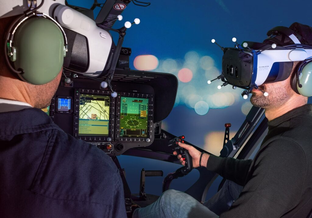 Two pilots wearing mixed reality headsets in the XR cockpit at night