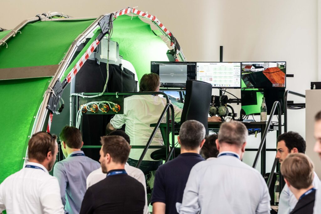 Guests watching a live demonstration of the XR simulator
