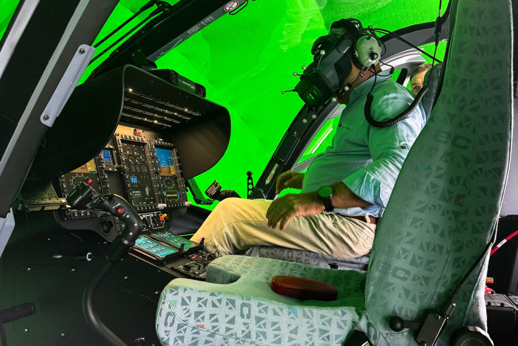 Pilot in the XR cockpit in front of the green screen during the assessment