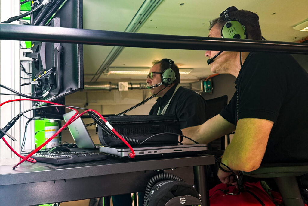 Instructor at the laptop station next to the XR simulator