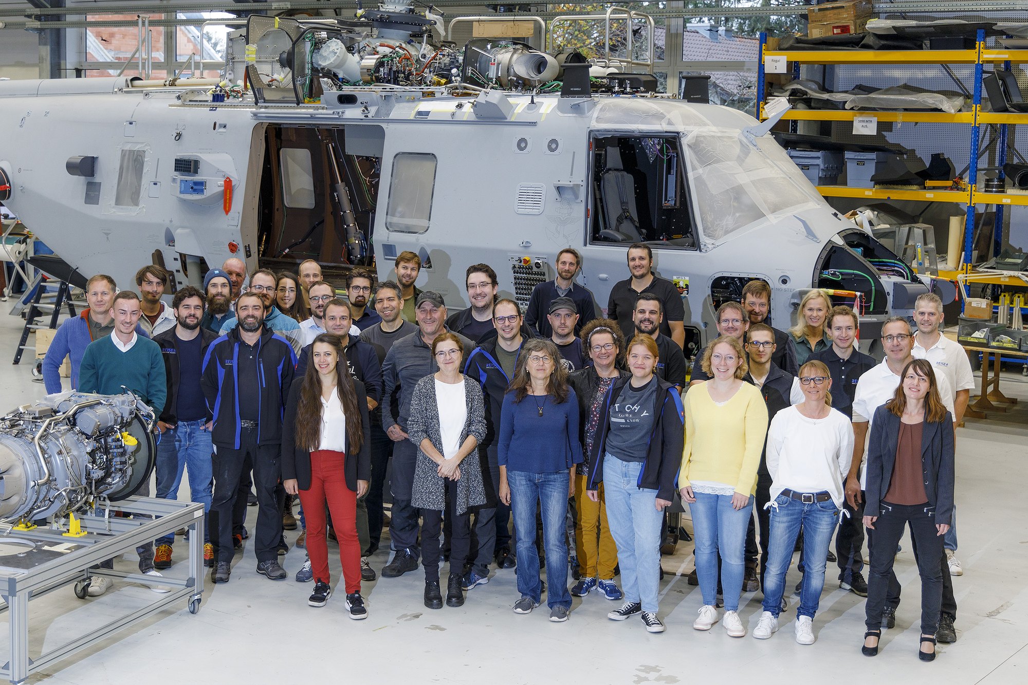 Why REISER, team photo in front of the simulator