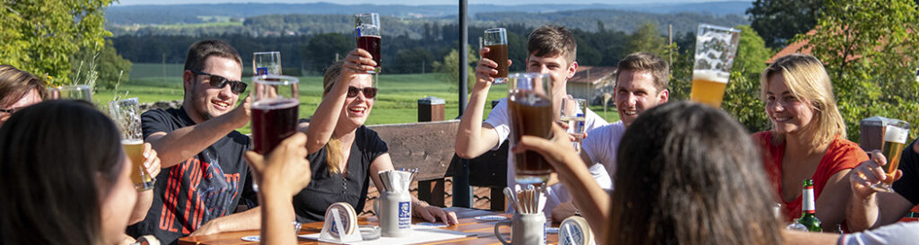 The team raising a toast in the beer garden