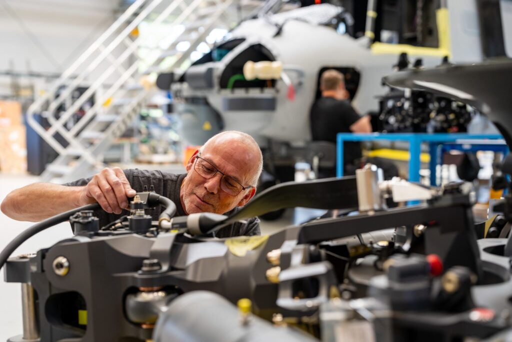 REISER technician assembling a rotor component in the workshop