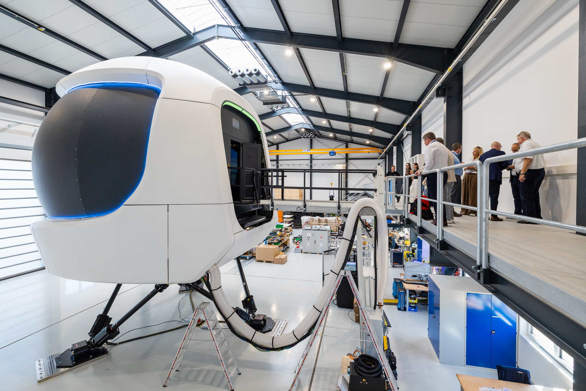 Guests experience the new 11 ft Level D full-flight simulator during a live demonstration.